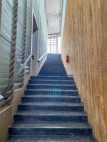 Building stairs with a fire extinguisher for use in emergencies. photo