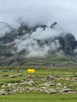 Camping tent on the peak of the Himalayas mountain and cloud photo