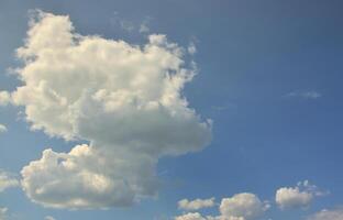 Beautiful blue sky background template with some space for input text message below isolated on blue photo