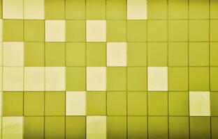 The texture of the metal wall, framed in the form of colored squares of two colors. Modern wall design for the exterior of residential and office buildings photo