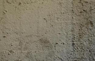 Texture of the old embossed concrete wall in gray color. Background image of a concrete product photo