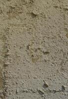 Texture of the old embossed concrete wall in gray color. Background image of a concrete product photo
