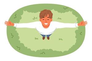 Happy man stands on lawn and looks up enjoying rays of sun and fresh air on summer day vector