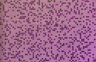 The texture of the wall, decorated with a mosaic of various small square tiles. Abstract pattern of ceramic tiles on the wall photo
