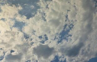 Beautiful blue sky background template with some space for input text message below isolated on blue photo