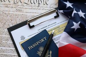 Department of State form DS11 Application for a U.S. Passport lies on table and ready to fill photo