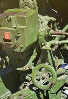 A close-up mechanism of a portable weapon of the Soviet Union of World War II, painted in a dark green color photo