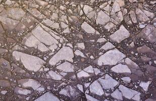 Background of shattered stony stones surface in mountain area. Texture with natural light photo
