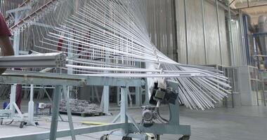 Panorama of a large assembly hall with metal structures in a factory video