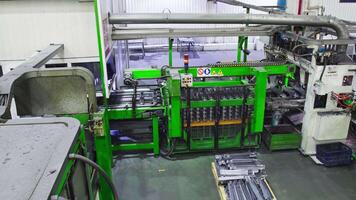 Drone on conveyor belt in large factory workshop video