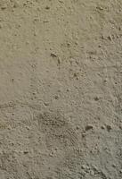 Texture of the old embossed concrete wall in gray color. Background image of a concrete product photo