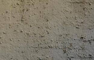 Texture of the old embossed concrete wall in gray color. Background image of a concrete product photo