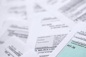 Very big amount of polish tax form blanks with PIT, CIT and VAT categories. Accounting, bureaucracy and taxpayers routine in Poland photo
