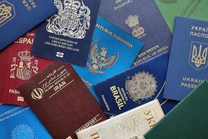 Many various passports of citizens of different countries and regions of the world photo