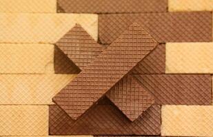 Stacked delicious chocolate wafers in large amount. Two different flavours of classic waffles photo