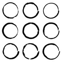 Circles grunge black borders on white background. A group of labels with uneven rough edges drawn with an ink brush. Design elements, 9 circle frames. Grunge borders vector