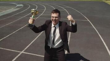 Top View Of The Winning Corporate Business Man In An Office Suite With A Cup In photo