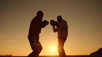Bottom View Of A Silhouette Shadow Of A Two Black Men Are Engaged In Boxing photo