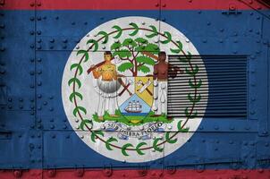 Belize flag depicted on side part of military armored tank closeup. Army forces conceptual background photo