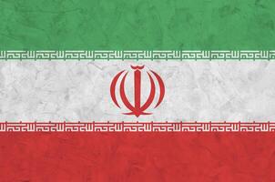 Iran flag depicted in bright paint colors on old relief plastering wall. Textured banner on rough background photo