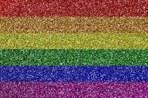LGBT community flag depicted on many small shiny sequins. Colorful festival background for party photo