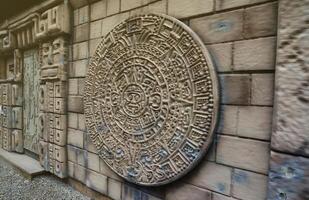 Ancient Mayan Calendar or Aztec calendar with rough relief surface photo