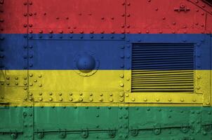 Mauritius flag depicted on side part of military armored tank closeup. Army forces conceptual background photo