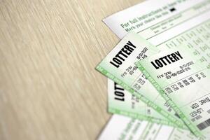 Green lottery tickets and blank bills with numbers for playing lottery photo