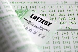 Green lottery tickets and blank bills with numbers for playing lottery photo