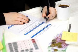 Accountant fill french tax form 3916 Declaration by resident of account opened, held used or closed abroad in end of tax period. Taxation and paperwork routine photo