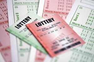 Green and red lottery tickets on blank bills with numbers for playing lottery photo