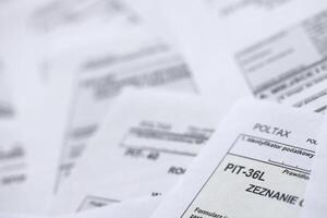 Very big amount of polish tax form blanks with PIT, CIT and VAT categories. Accounting, bureaucracy and taxpayers routine in Poland photo