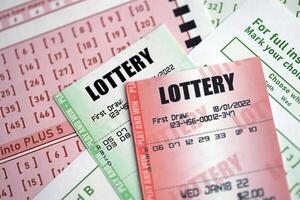Green and red lottery tickets on blank bills with numbers for playing lottery photo