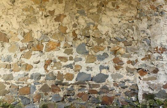 Texture of a stone wall with many big brown and grey stones armed with cement. Old castle stone wall texture background for medieval usage. Part of a stony building photo