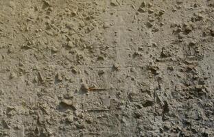 Texture of the old embossed concrete wall in gray color. Background image of a concrete product photo