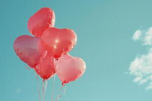 Bunch of heart-shaped balloons released into the air, symbolizing love and affection photo