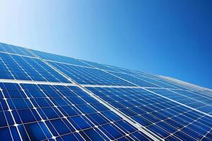Solar panels against a clear blue sky, harnessing renewable energy for a greener future photo