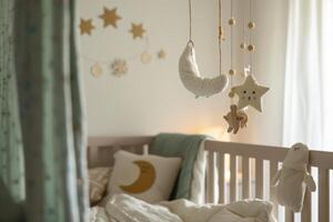 Cozy baby nursery with a soothing lullaby mobile hanging above the crib, creating a calming atmosphere photo