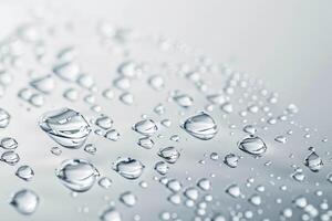 Refreshing water droplets on a transparent white surface, ideal for lively scenes photo