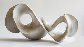 A large, curved, white sculpture with a hole in the middle. The sculpture is made of a material that is not clear, but it is a type of stone photo