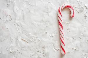 Whimsical Christmas candy cane on a transparent white canvas, perfect for festive decorations photo