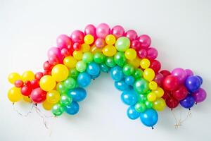 Colorful balloons arranged in the shape of a rainbow, symbolizing hope and positivity photo