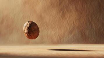 Bold silhouette of levitating hazelnut in a minimalist brown composition photo