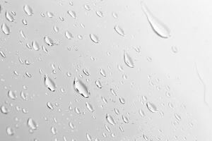 Raindrops on a soft transparent white backdrop, perfect for gentle ambiance photo