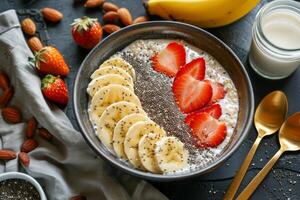 Bowl of overnight oats with chia seeds, almond milk, and sliced fruits, a convenient and nutritious breakfast option photo