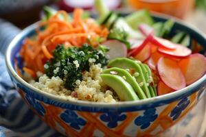 Close-up of a colorful buddha bowl filled with quinoa, avocado, and assorted veggies photo