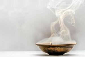 Burning incense releasing fragrant smoke against a soft transparent white background, ideal for spiritual and mystical themes photo