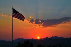 American flag on a pole against a sunset backdrop photo