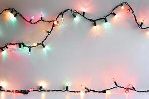 Festive Christmas lights against a soft transparent white backdrop, perfect for festive artworks photo