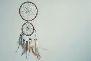 Bohemian dreamcatcher decoration against a soft transparent white surface, adding a touch of mystique photo
